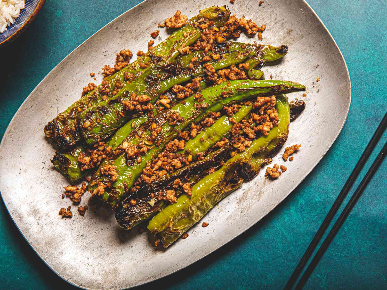 Tiger peppers on a serving platter with ground pork