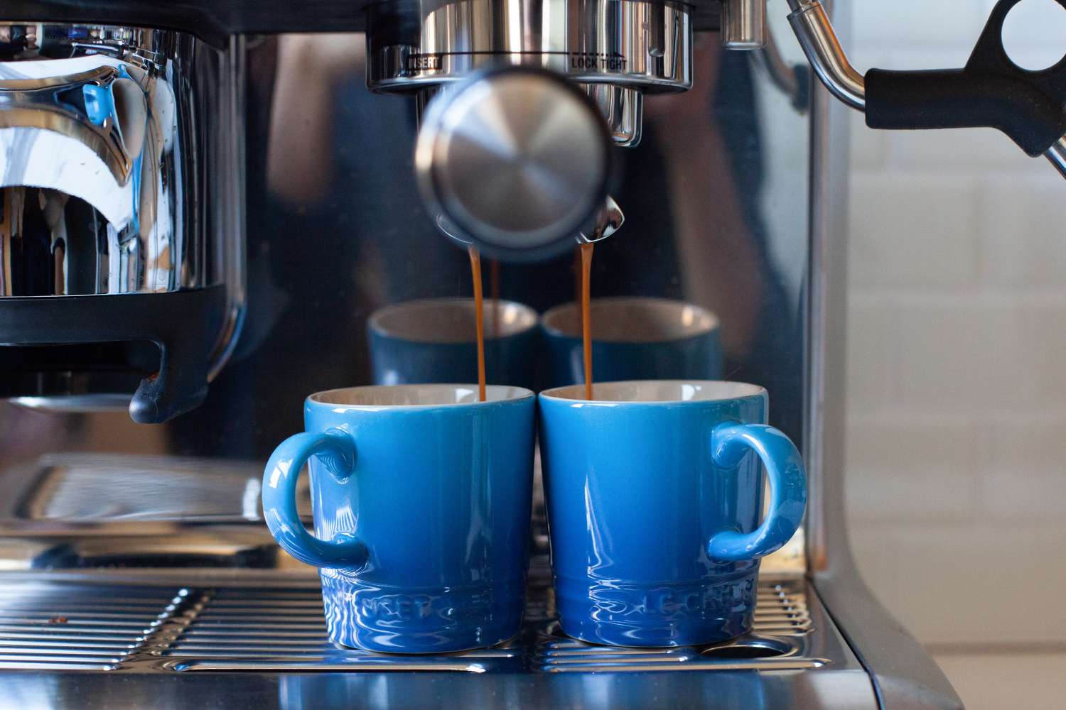 pouring espresso into Le Creuset Espresso Mugs 