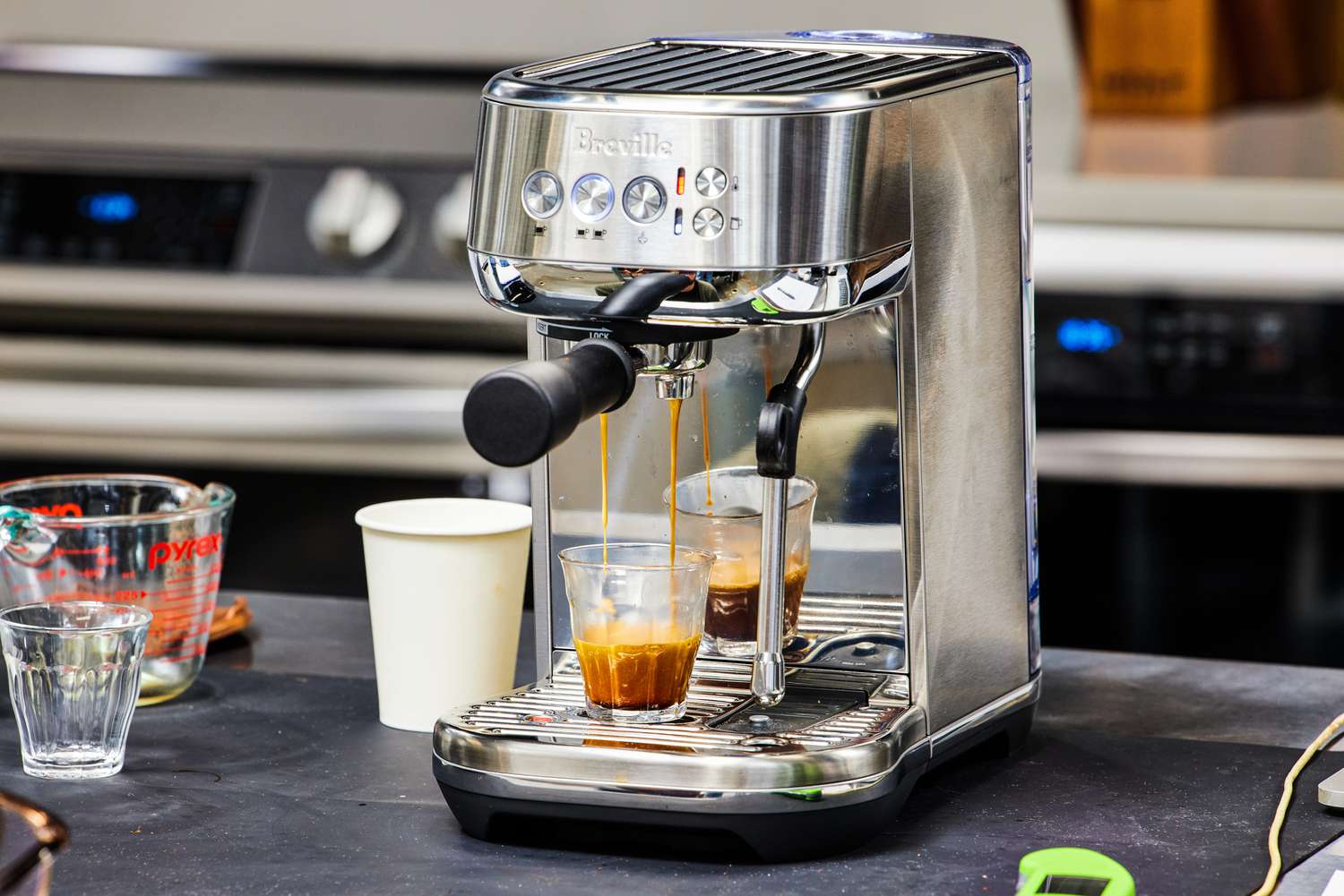 The Breville Bambino Plus Espresso Machine making an espresso