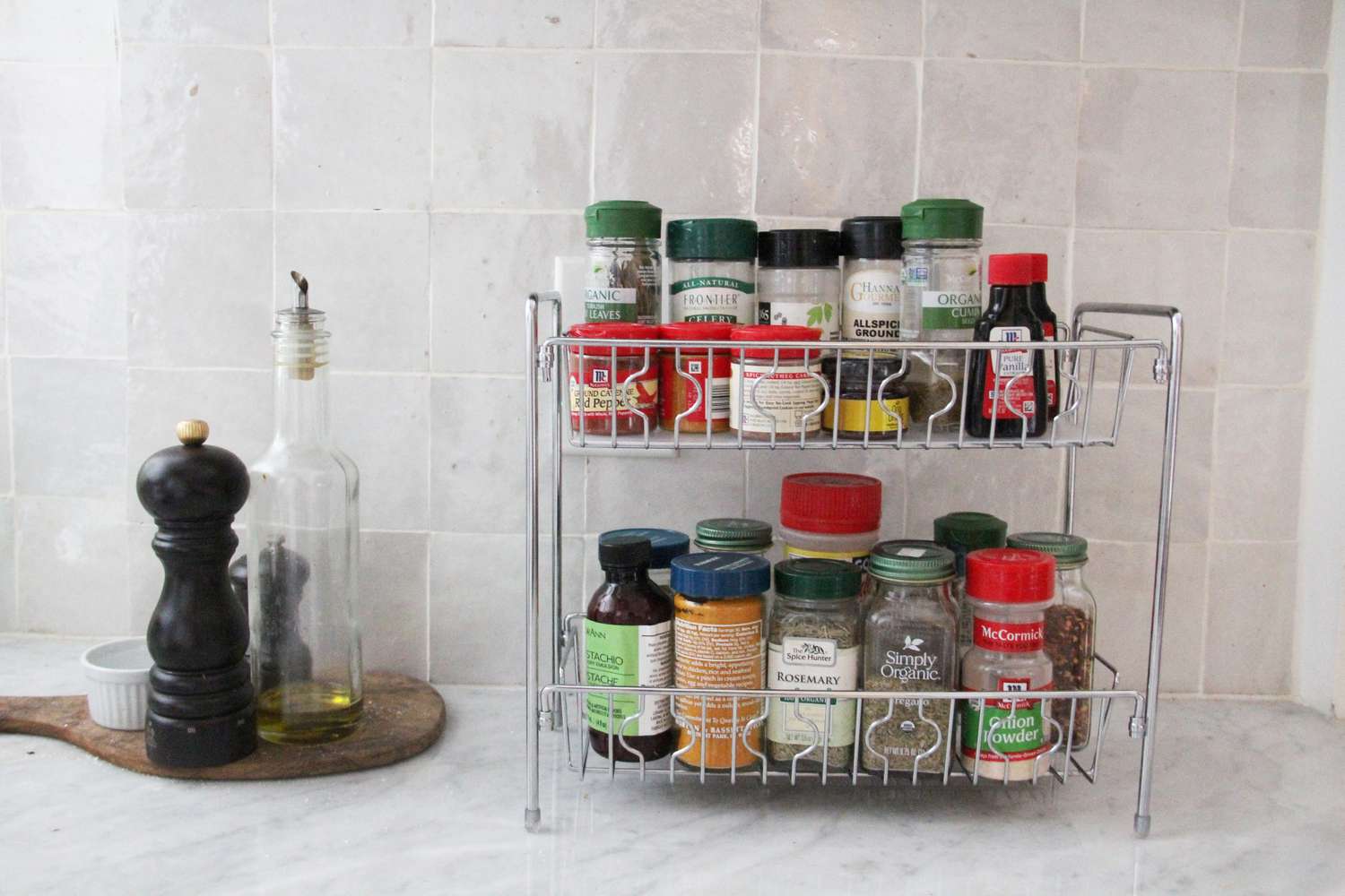 spices in a metal spice rack on a counter