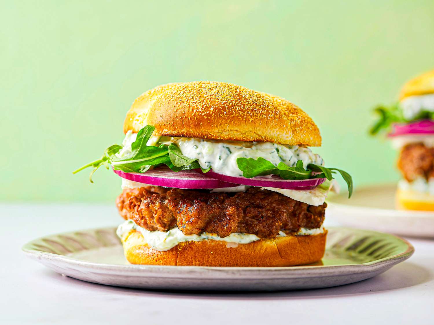 Plated lamb burger showing all its layers