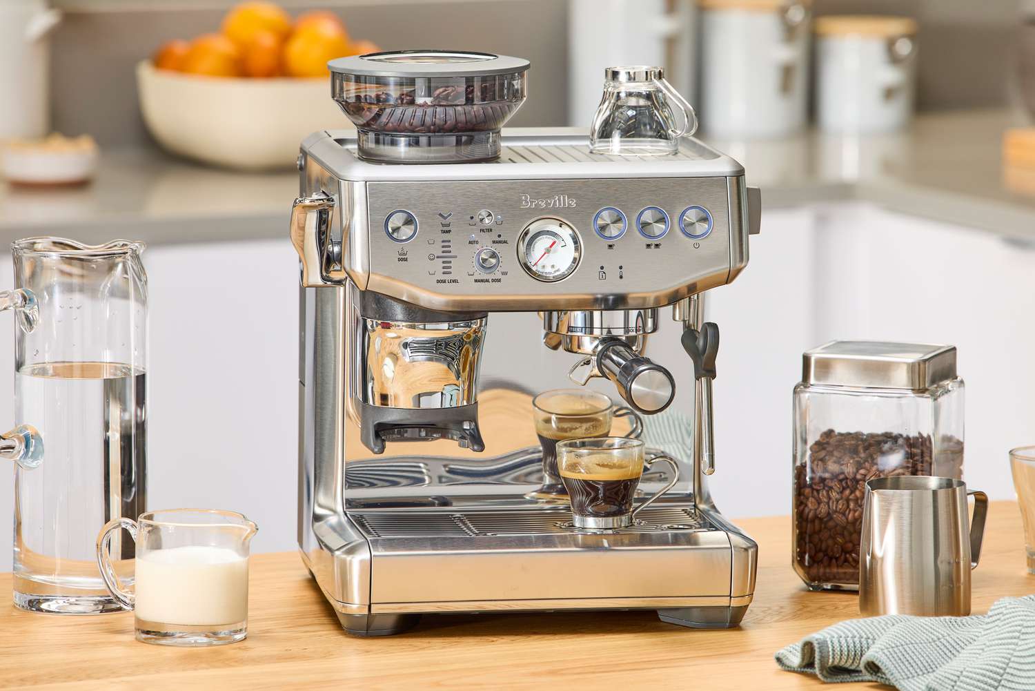 The Breville Barista Express Impress on a kitchen countertop.