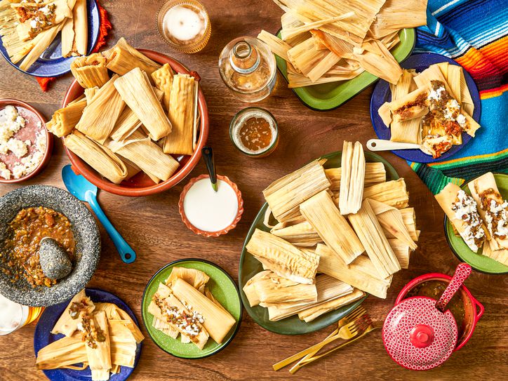 Overhead view of tamales on a table spread