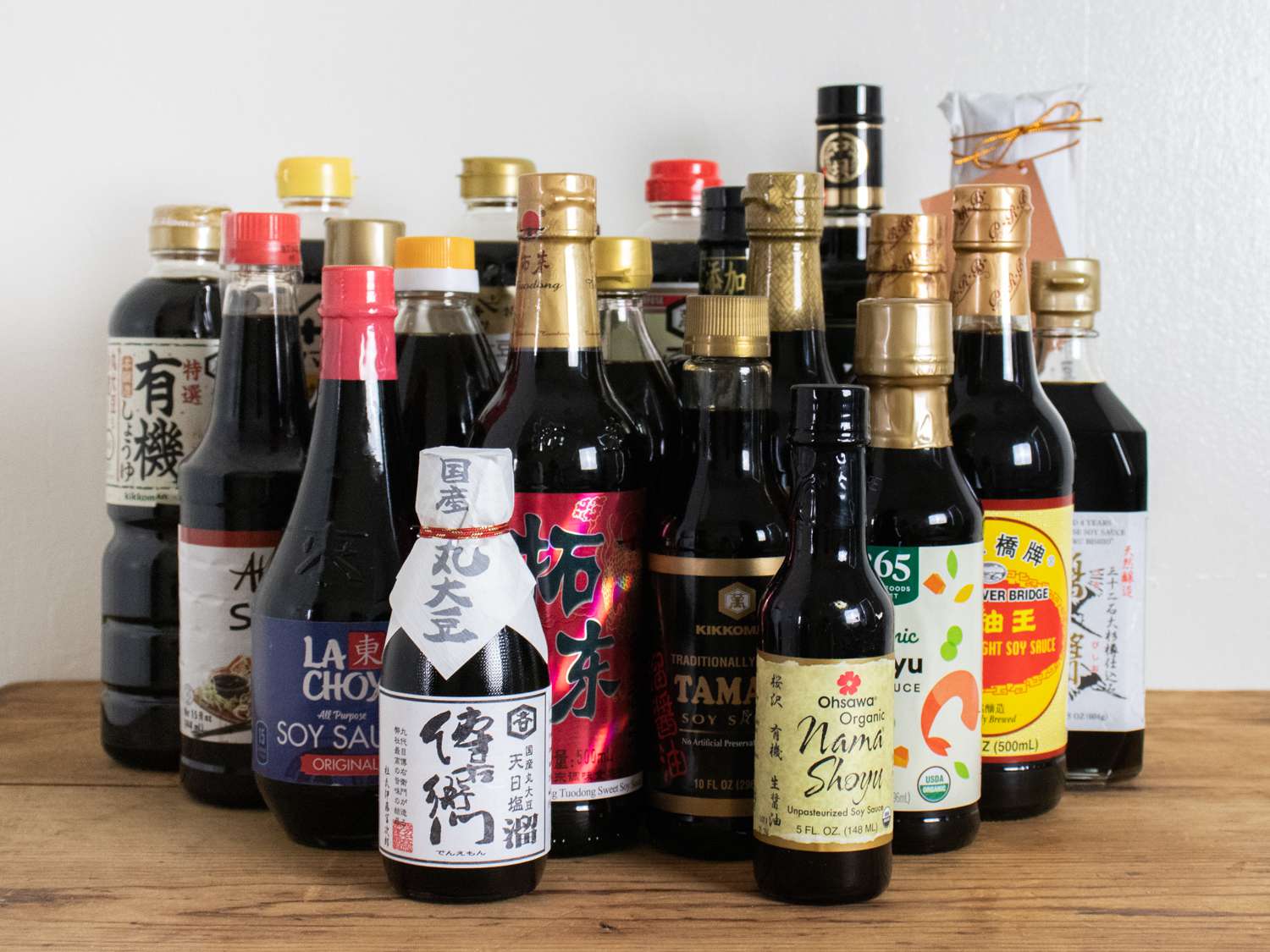 Collection of different types of soy sauces on a table