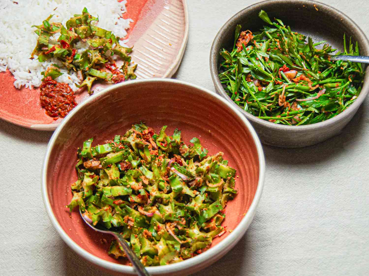 Angled view of multiple bowls of kerabu