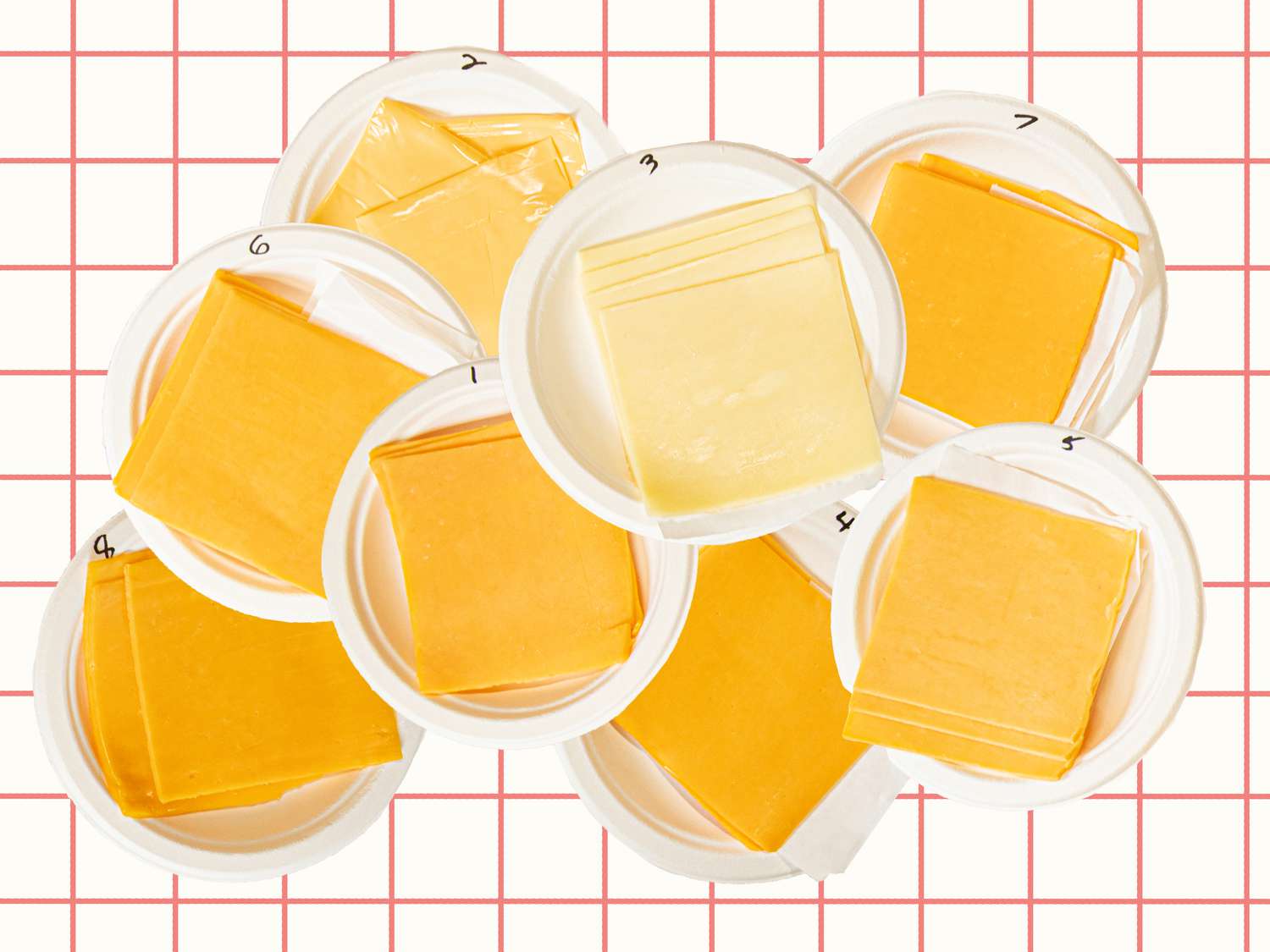 A pile of cheeses on a checkered backdrop