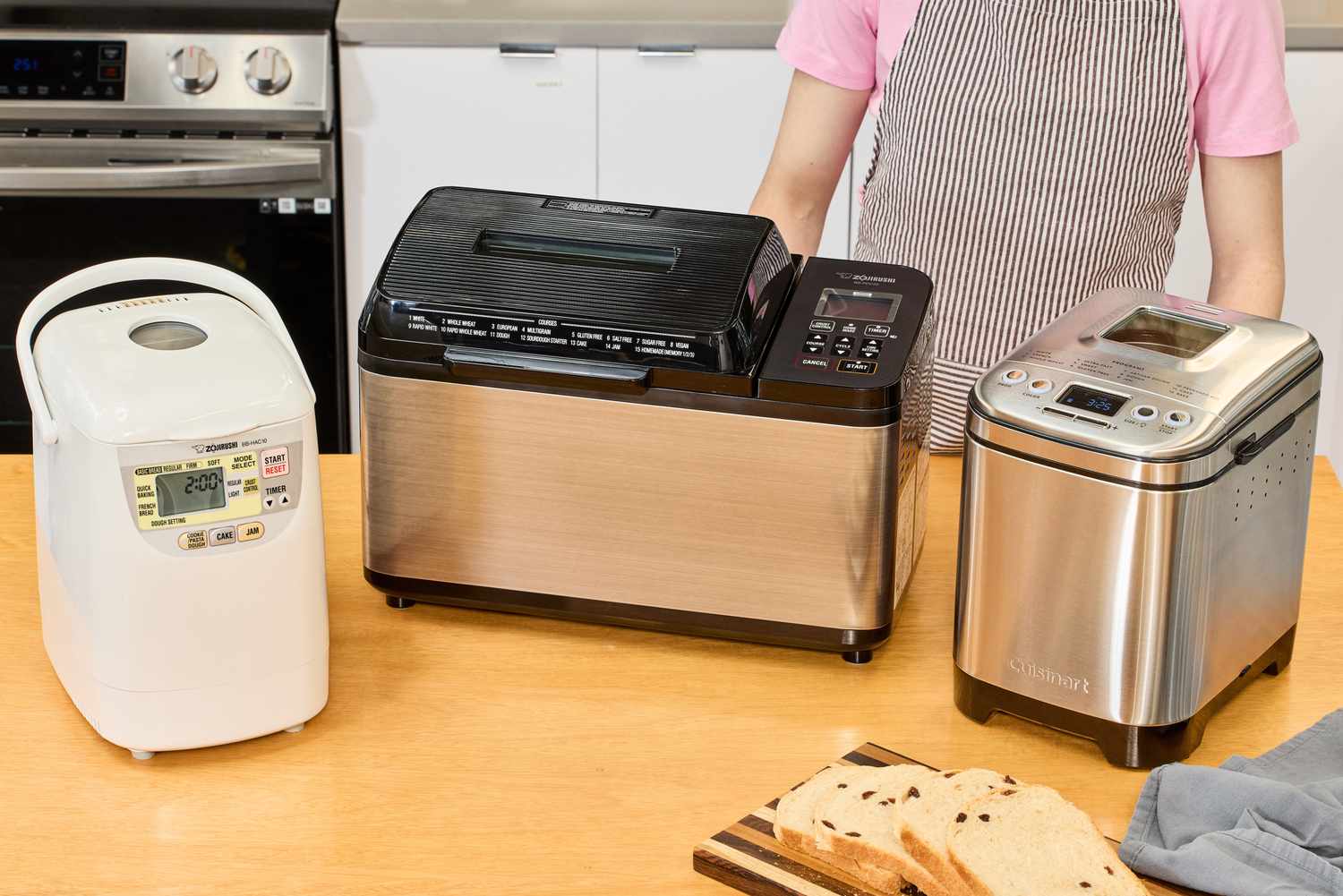 Three bread machines on a countertop