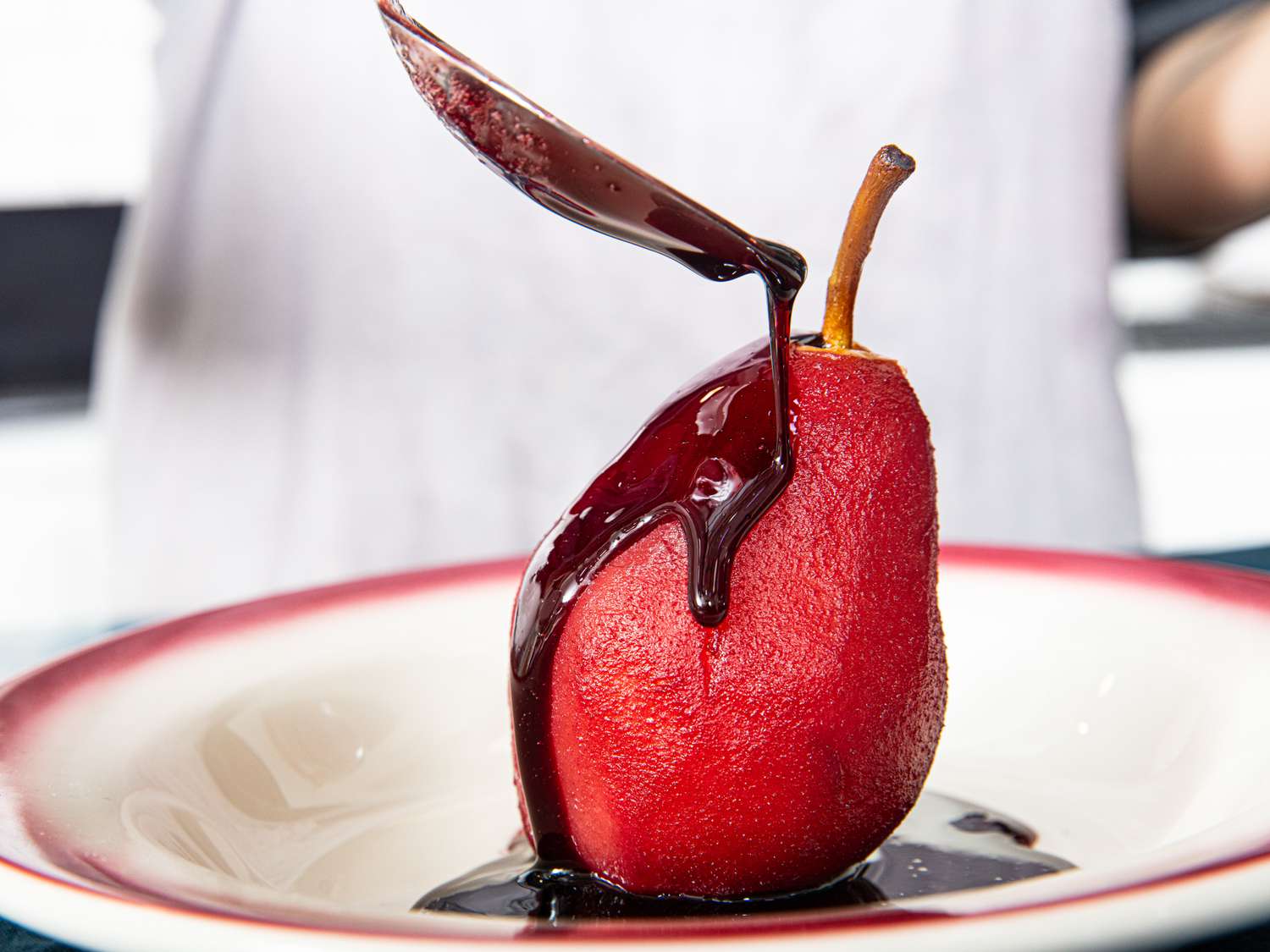 Glazing poached pear