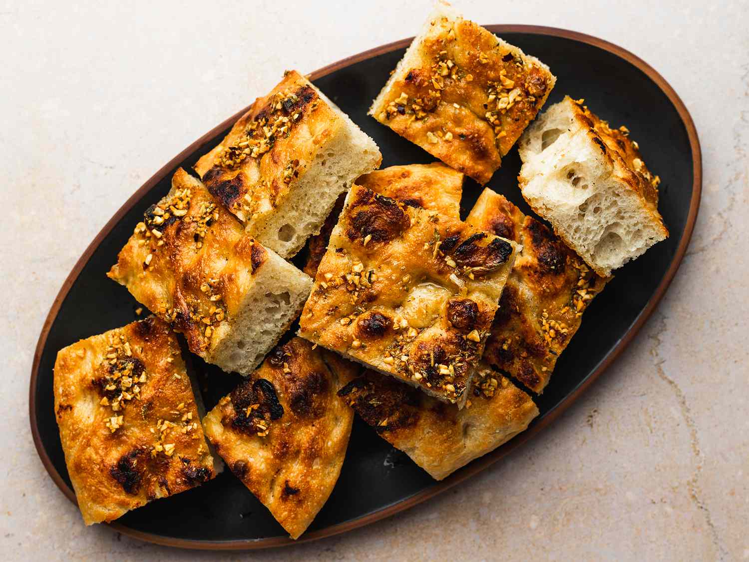 Overhead shot of no-knead roasted-garlic focaccia bread.