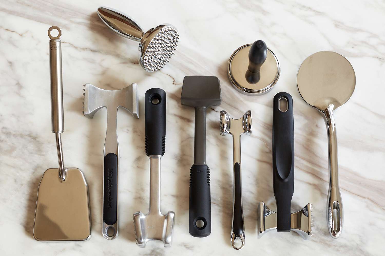 a group of meat pounders on a marble countertop