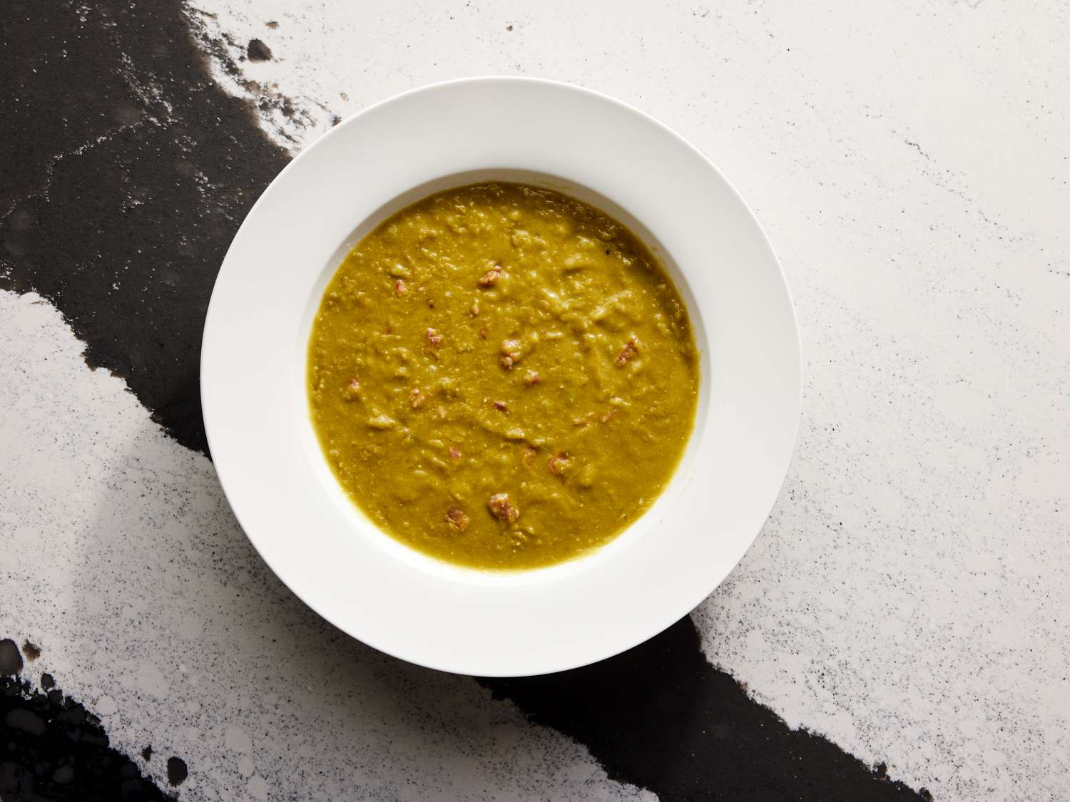 Overhead view of split pea and hand soup