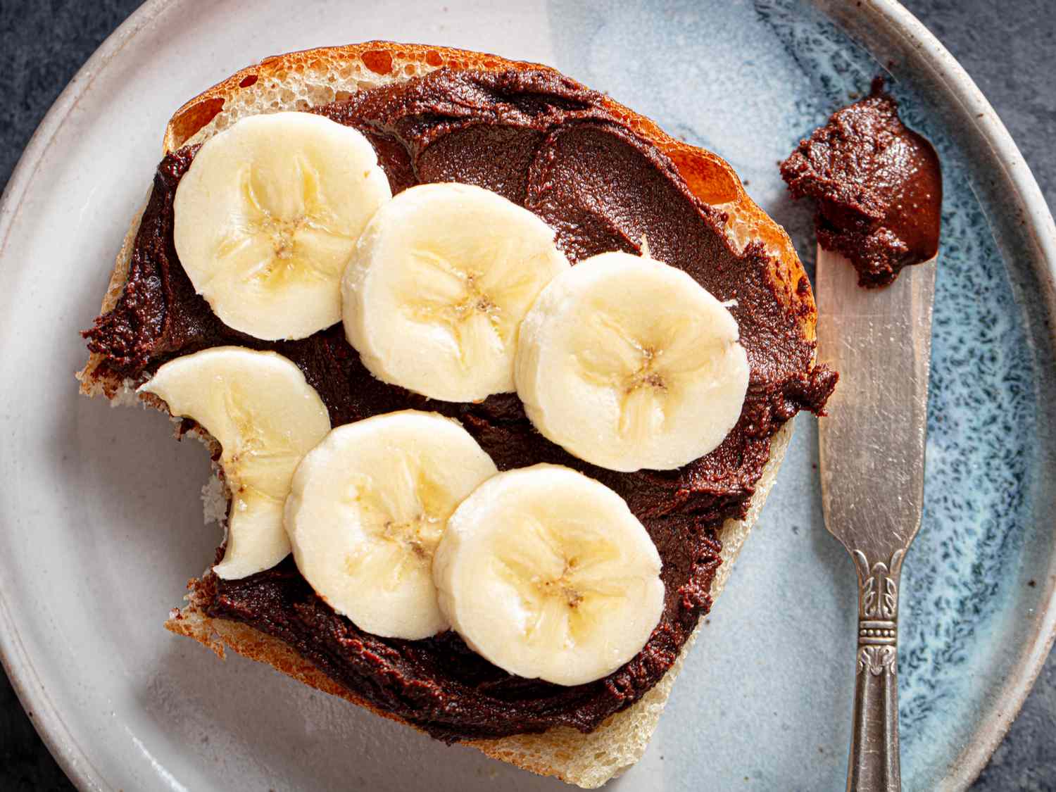 Overhead view of toast with homemade nutella and bananas