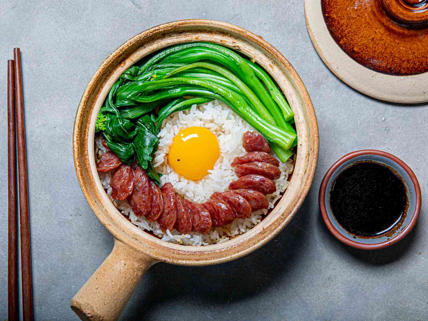 Cantonese clay pot rice with Chinese sausage and greens.