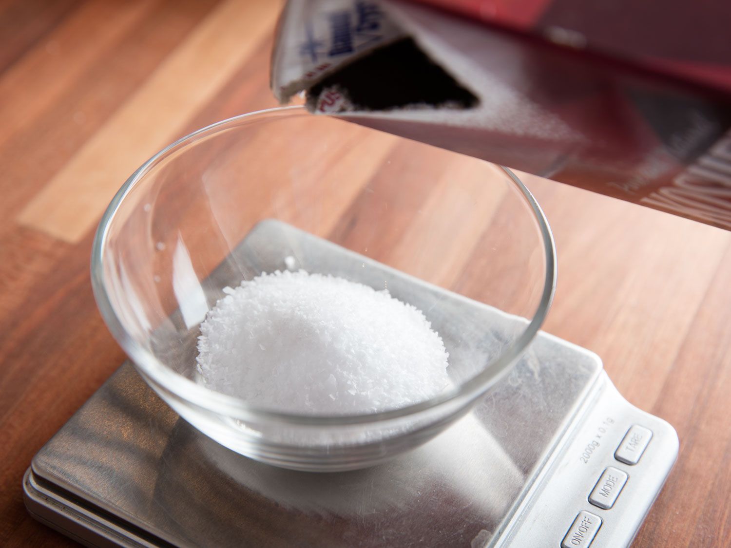 Salt Being Poured on a Gram Scale